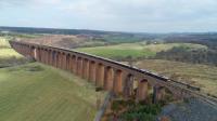 66743 and 66746 double head *The Royal Scotsman * over Culloden Viaduct on<br>
the way to Aviemore from Inverness. From Aviemore the train will be hauled<br>
by a Strathspey Railway engine to Boat of Garten.<br><br>[John Gray 14/04/2018]