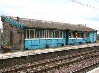The attractive waiting room at Chathill, Northumberland, photographed looking east across the ECML from the down platform in October 2012. Doubtless a boon in bad weather for passengers using the morning or evening train south. There is no waiting area on the down platform as both northbound daily services terminate here. [See image 16285]<br><br>[John Furnevel 08/10/2012]