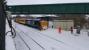 DRS 37602 encounters a small snowdrift alongside Dunblane signal box on the afternoon of Friday 2nd March 2018. The loco was top and tailed with a Class 66 on a Network Rail special. This is Network Rail's 'Snow Train / Winter Train'. the bridge is the Bridgend footbridge beside the signal box - the most northerly structure to be altered for electrification.<br>
<br>
<br><br>[David Prescott 02/03/2018]