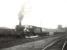 A Sunday relief to the up <I>Thames-Clyde Express</I> runs past Dumfries South goods yard shortly after leaving the station on 15 July 1956. Locomotive in charge is Corkerhill Jubilee 45711 <I>Courageous</I>. [Ref query 7 March 2018]<br><br>[G H Robin collection by courtesy of the Mitchell Library, Glasgow 15/07/1956]