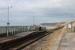 Nethertown station was a passing loop until the 1970s but only one platform is in use now. This remote but atmospheric halt on the Cumbrian Coast sees four 'on request' services each way on weekdays. This was the scene on a sunny 8th March 2018, looking towards St Bees Head, with two passengers waiting for the train. <br><br>[Mark Bartlett 08/03/2018]