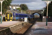 Former ScotRail Class 158, 158870 still with spots, heads east from Ulverston on 20th March 2018 whilst on a Barrow to Lancaster crew training run.<br><br>[John McIntyre 20/03/2018]