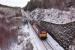 Still in full EWS livery, 67007 hauls the late running Caledonian Sleeper through the winterscape near Slochd Summit on 2nd April 2018.<br>
<br>
<br><br>[John Gray 02/04/2018]