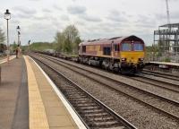 <h4><a href='/locations/L/Leamington_Spa'>Leamington Spa</a></h4><p><small><a href='/companies/B/Birmingham_and_Oxford_Railway'>Birmingham and Oxford Railway</a></small></p><p>A long freight comes off the Coventry line at Leamington, having just passed through Kenilworth station on its opening day see image <a href='/img/63/849/index.html'>63849</a>. The building on the right appears to be occupied by a skeleton staff. 83/99</p><p>30/04/2018<br><small><a href='/contributors/Ken_Strachan'>Ken Strachan</a></small></p>
