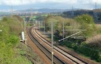 <h4><a href='/locations/R/Ravelrig_Junction'>Ravelrig Junction</a></h4><p><small><a href='/companies/C/Caledonian_Railway'>Caledonian Railway</a></small></p><p>Ravelrig Junction in a view looking east in 1999. The ballasted area to the right of the track was the junction sidings with the junction itself beyond. 2/81</p><p>//1999<br><small><a href='/contributors/Ewan_Crawford'>Ewan Crawford</a></small></p>