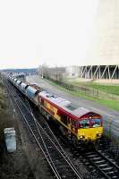 An EWS class 66 departs from Drax power station with coal empties.<br><br>[Ewan Crawford //]
