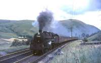 BR Standard class 5 4-6-0 73064 climbs unassisted towards Harthope viaduct in the summer of 1965.<br><br>[John Robin 31/07/1965]