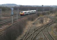 Looking south towards Carluke from Law Junction in March 2006 as a Voyager runs past the former carriage sidings.<br><br>[John Furnevel 10/03/2006]