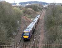 A diverted Edinburgh - Glasgow shuttle emerging from the tunnel under the Union Canal at Craiglockhart Junction on 2 April 2006 on its way to join the main line at Haymarket West Junction.<br><br>[John Furnevel 02/04/2006]