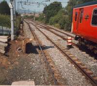 Eastbound train entering Westerton. Note the platforms have just been cut back by a few metres. Also note the unaltered layout of the junction (altered twice since then) and the box still standing.<br><br>[Ewan Crawford //1987]