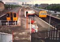 Springburn station. Milngavie train on left and Cumbernauld train on right.<br><br>[Ewan Crawford //1987]