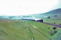 70049 south of Abington with the only steam hauled train at the return Glasgow Fair.<br><br>[John Robin 29/07/1967]