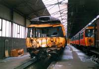 303051 badly damaged in Hyndland Depot in 1987. The EMU had been in collision with a class 37 at Dalmuir after running away. [Access by kind permission of British Rail]<br><br>[Ewan Crawford //1987]