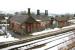 View west across the running lines at Sanquhar in the spring of 2006 showing the old station building on the down platform. Opened in 1850, the station was closed in 1965, only to reopen in 1994. (The boarded up building was subsequently restored and converted to holiday accommodation, thanks to Peter Rushton. [See image 5794])<br><br>[John Furnevel 14/03/2006]