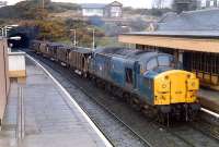 A 37 with ballast from Inverkeithing heads south through North Queensferry.<br><br>[Ewan Crawford //1989]