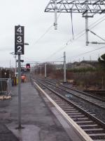 <h4><a href='/locations/C/Cumbernauld'>Cumbernauld</a></h4><p><small><a href='/companies/C/Caledonian_Railway'>Caledonian Railway</a></small></p><p>Carriage stop markers at platform 2, Cumbernauld. Overhead Line infrastructure in place. See Image <a href='/img/24/882/index.html'>24882</a> 5/5</p><p>21/02/2014<br><small><a href='/contributors/Colin_Harkins'>Colin Harkins</a></small></p>