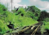 <h4><a href='/locations/B/Balerno_Goods_Junction'>Balerno Goods Junction</a></h4><p><small><a href='/companies/B/Balerno_Branch_Caledonian_Railway'>Balerno Branch (Caledonian Railway)</a></small></p><p>Balerno Goods Junction ground frame with Lanark Road just above to the left and the former Newmills Mill. The line met the Water of Leith here and followed the river downstream for just under five miles to Balerno Junction. 10/81</p><p>//<br><small><a href='/contributors/Don_Shaw'>Don Shaw</a></small></p>