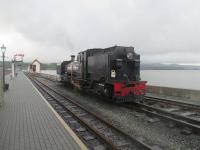 <h4><a href='/locations/P/Porthmadog_Harbour_WHR'>Porthmadog Harbour [WHR]</a></h4><p><small><a href='/companies/F/Festiniog_Railway'>Festiniog Railway</a></small></p><p>Ex-South African Railways NGG16 2-6-2+2-6-2T Garratt no.87, built 1937 by the engineering firm Cockerill and restored at the Ffestiniog Railway's Boston Lodge works, shunting at Porthmadog Harbour station before being attached to a Welsh Highland Railway train to Caernarfon, on 22nd May 2016. 1/10</p><p>22/05/2016<br><small><a href='/contributors/David_Bosher'>David Bosher</a></small></p>