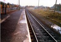 Dunlop. Remains of northbound platform on right. Carlisle train receding into distance.<br><br>[Ewan Crawford //1987]