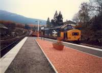 37 with permanent way train enters Crianlarich from the south.<br><br>[Ewan Crawford //1987]
