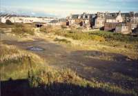 View of Ardrossan North coal yard taken, accidentally, from the same viewpoint as Geo C. OHaras 6 years earlier. The main line ran from left to the overbridge centre left. Now built on.<br><br>[Ewan Crawford //1987]