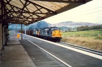 Ravenscraig bound Iron Ore passing West Kilbride.<br><br>[Ewan Crawford //1987]