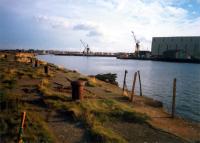 Troon Harbour looking to the land along the eastern breakwater. Ailsa Shipbuilders on right.<br><br>[Ewan Crawford //1987]