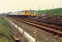 A 477 propelled train heads west at Greenhill Upper Junction.<br><br>[Ewan Crawford //1988]