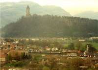 Approaching Stirling from the north. Viewed from Stirling Castle and the Wallace Monument and Ochil hills provide a backdrop.<br><br>[Ewan Crawford //1988]