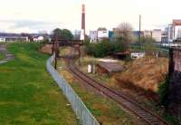 Alloa looking east over the former junction between the Devon Valley line (left, lifted) and Dunfermline line (not lifted). This was the east end of the station. The bridge carried the Alloa Waggonway.<br><br>[Ewan Crawford //1988]