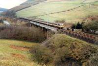 Southbound train crosses the Harthope Viaduct before the land was scarred with more roads.<br><br>[Ewan Crawford //1988]