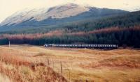 Northbound 37 approaches the redundant distant signal south of Crianlarich.<br><br>[Ewan Crawford //1988]