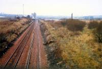 Carmyle looking west. From left to right; Norit works (still there), route to Rutherglen, demolished Clyde Iron (and distant Clydebridge Steelworks), route to Glasgow Central Low Level.<br><br>[Ewan Crawford //1988]