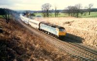 Eastbound 47 hauled train to the east of Hartwood on E&G diversion.<br><br>[Ewan Crawford //1988]