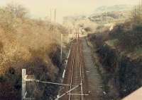 Looking east away from the eastern portals of the two Wemyss Bay Cartsburn tunnels. The line was originally single track and a second, now redundant, bore was required. In the middle distance the line was crossed by the G&SW line.<br><br>[Ewan Crawford //1988]