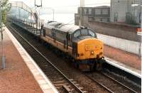 37 406 heads west with a West Highland timber train.<br><br>[Ewan Crawford //1990]