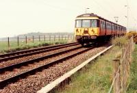 311 098 approaching Ardmore Level Crossing going east.<br><br>[Ewan Crawford //1990]