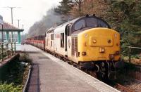 The lunchtime speedlink to Crianlarich enters Arrochar and Tarbet. Hauled by 37 403<br><br>[Ewan Crawford //1990]