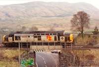 Not something you see every day, 37 403 effectively being reversed to Crianlarich from Crianlarich Lower Junction. This bridge and another just west (both on this short spur) are contributors to the proposed Crianlarich bypass.<br><br>[Ewan Crawford //1990]