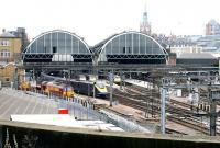 Full width view of Kings Cross showing all three trainsheds in July 2005. The station's <I>Eastern Range</I> building is on the left of the picture with the St Pancras clock tower in the right background.<br><br>[John Furnevel /07/2005]