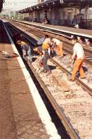 <i>Ive been working on the railroad ...</i> using pneumatic drills and earmuffs to cover the sound of 37s at Dumbarton Central.<br><br>[Ewan Crawford //1990]