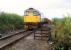 A 26 backs down on a train of Molasses at Cambus Junction. View looks west.<br><br>[Ewan Crawford //1988]