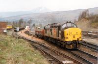 37 403 heading south from Crianlarich with a not particularly taxing load. Access by kind permission of British Rail.<br><br>[Ewan Crawford //1990]