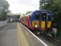 <h4><a href='/locations/R/Raynes_Park'>Raynes Park</a></h4><p><small><a href='/companies/W/Wimbledon_and_Dorking_Railway'>Wimbledon and Dorking Railway</a></small></p><p>455s 5718 and 5872, with the ex-13.47 South West Trains service from Waterloo to Chessington South, arriving at Raynes Park on Saturday, 22nd October 2022. The down main platform is to the left while the up line from the Epsom direction passes under all four main line tracks to come up into the north side of the up island platform, staggered from the south.  (See my photo image no. 83083, taken same day, for further brief details of this station's history.) 10/16</p><p>22/10/2022<br><small><a href='/contributors/David_Bosher'>David Bosher</a></small></p>
