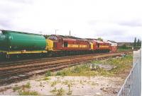 37406 and 37421 are seen at Dalwhinnie with a tanker Train in 2003.<br><br>[John Gray //]