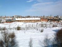 Looking north from Askew Road over the sad remains of Gateshead shed on a snowy February day in 2004. The King Edward Bridge - Greensfield route runs left to right across the centre of the picture and part of the QEII Bridge, built to carry the Metro across the Tyne, can be seen in the left centre background.<br><br>[Ewan Crawford 28/02/2004]