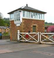 The 1877 signal box at Haydon Bridge in May 2006. The box stands on the north side of the level crossing alongside the 1838 station on the Newcastle & Carlisle line. The crossing is notable as one of the declining number in the UK where crossing gates continue to be mechanically operated by the signalman turning a wheel within the box. [Gates subsequently replaced by lifting barriers]<br><br>[John Furnevel 06/05/2006]
