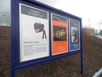 Three of the commemorative posters produced by Stewarton Academy on display outside the town's railway station on 27 April 2010.<br><br>[First ScotRail 27/04/2010]