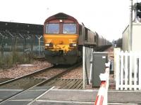A Longannet coal train on the direct route via Stirling and Alloa about to run over Cambus level crossing on 22 December 2008 behind EWS 66159.<br><br>[John Furnevel 22/12/2008]