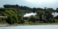 Steam train for Fort William is approached by a Glasgow bound EMU.<br><br>[Ewan Crawford 25/05/2006]